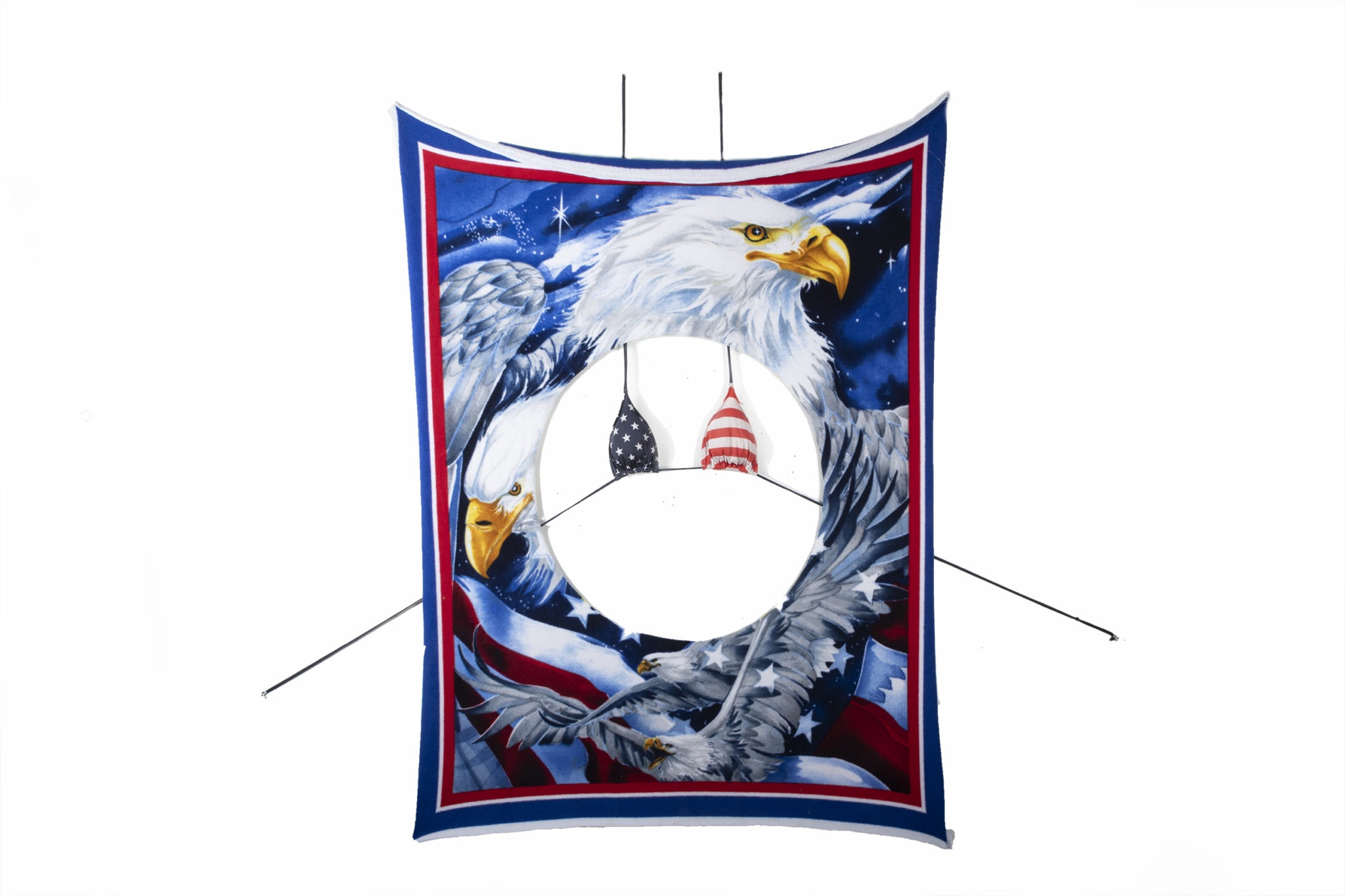 Image of Bella Maria Varela’s American GRL artwork. American flag and eagles on a four-foot by 10-foot blanket with a large circle cutout. A red, white, and blue US flag bikini top hangs behind the blanket and can be seen through the cutout.